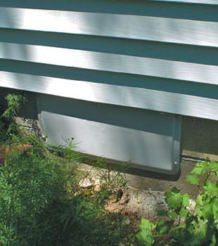 A gray crawl space vent cover in Burke