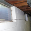 A foundation showing severe inward buckling along the windows in a Chantilly home.