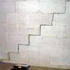 A diagonal stair step crack along the foundation wall of a Manassas home