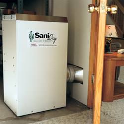 A basement dehumidifier with an ENERGY STAR® rating ducting dry air into a finished area of the basement  in Vienna