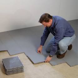 basement subfloor tiles being installed by a contractor in Great Falls
